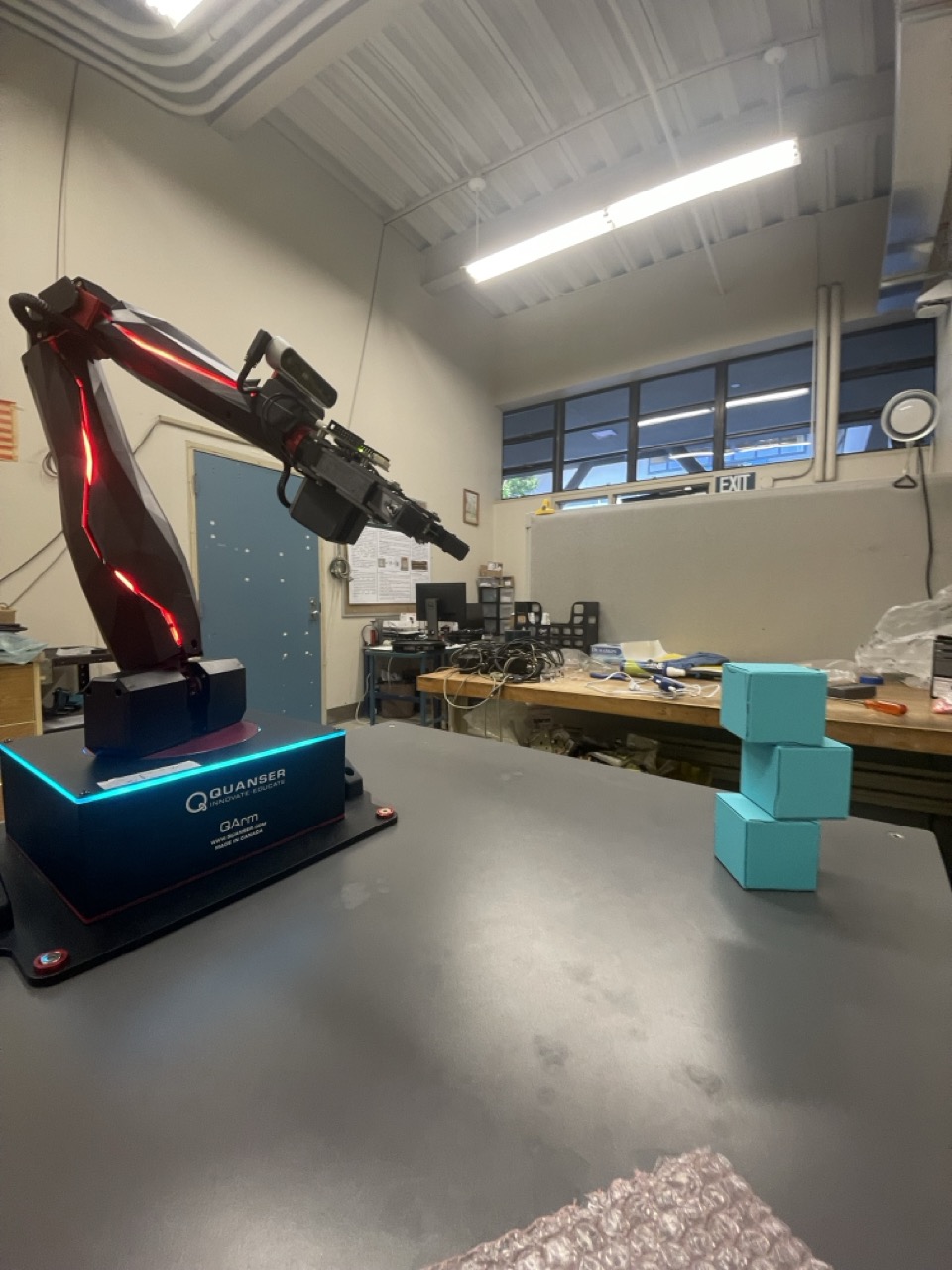 Quanser QArm thesis robot facing stacked cubes